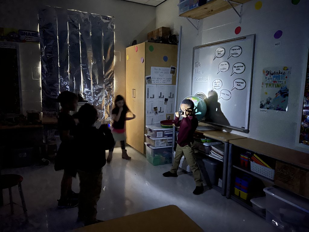 Students directing light