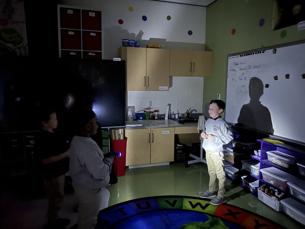 Students directing light 