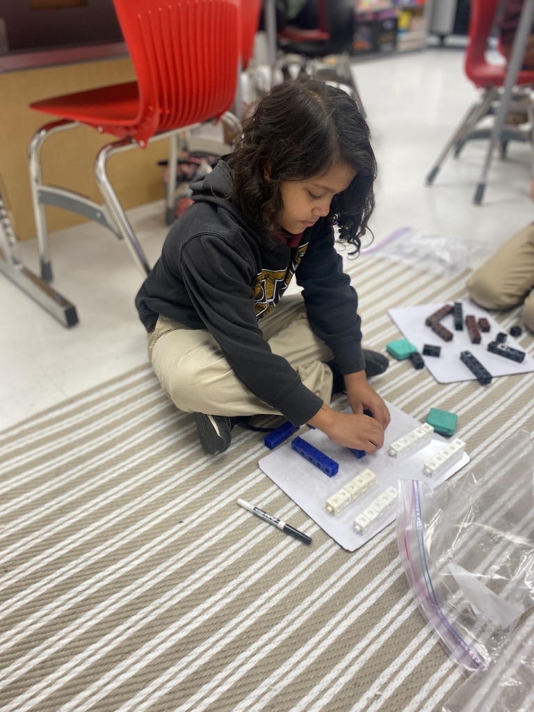 Students using cubes to count by tens